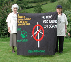 Angela
                Kelly and Ann West with Banner from Devon